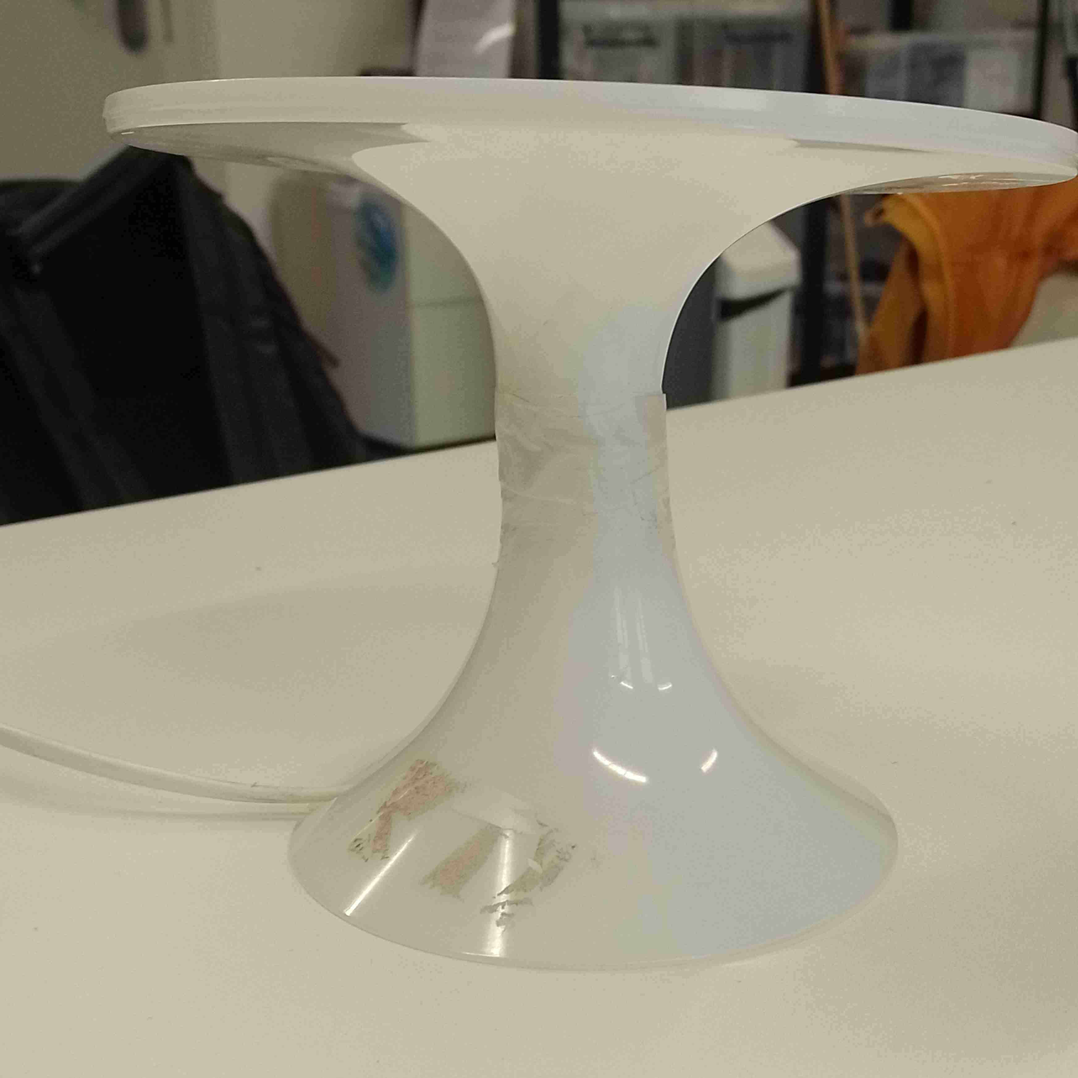Bottom part of the lamp with adhesive.